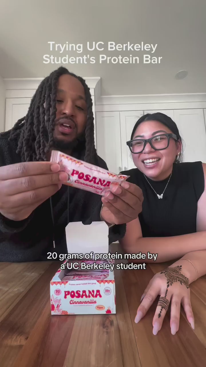 Two people taste-testing Posana Cinnavanilla bars